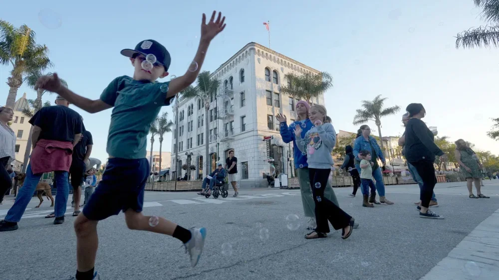 Jack Ferguson, 7, of Ventura, can't get enough of the bubble machine on July 30. The pedestrian friendly Main Street in Ventura has transformed the downtown experience and sparked debate among business owners. Photo courtesy of Juan Carlo/The Star
