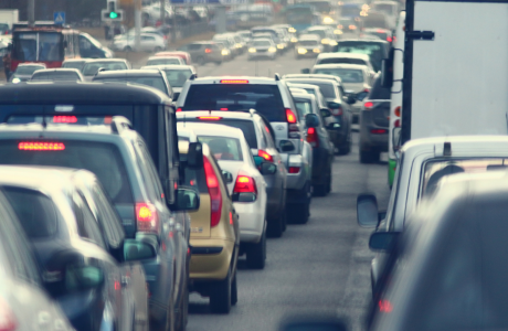 a close up shot of bumper-to-bumper traffic on a road