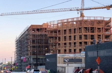 image of tent encampment outside a new building construction in Hollywood