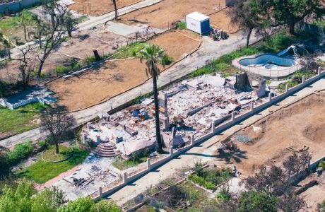 Ruins of a home after a wildfire.|