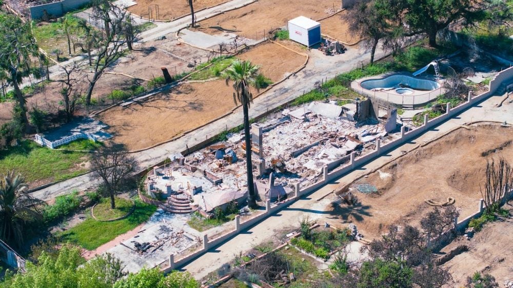 Ruins of a home after a wildfire.|