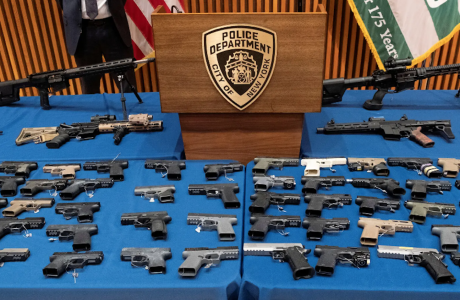 guns arrayed on table
