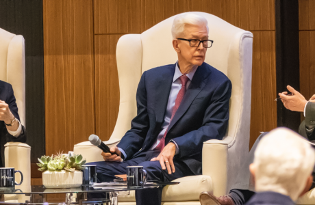 From left in large chairs on a stage during discussion at UCLA are Pete Wilson, Gray Davis and Jim Newton
