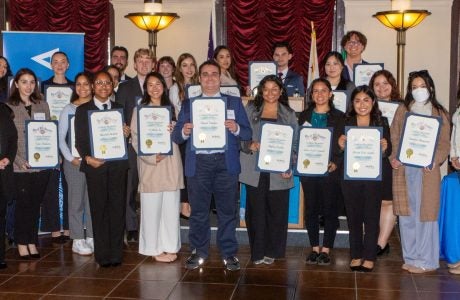 Luskin Students stand together for a group photo with their certificate of awards on the annual Luskin City Hall Day 2026.|Headshot of O'philia Le masters in urban planning student|MURP student O'philia Le at City Hall Day