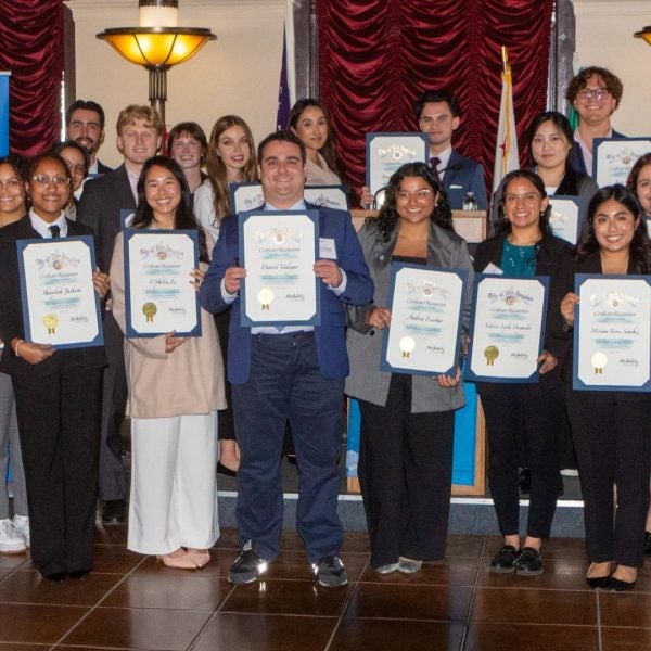 Luskin Students stand together for a group photo with their certificate of awards on the annual Luskin City Hall Day 2026.|Headshot of O'philia Le masters in urban planning student|MURP student O'philia Le at City Hall Day