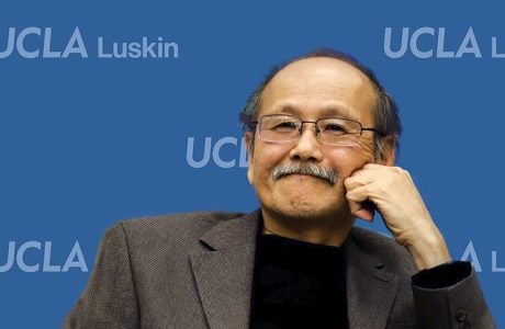Man in front of blue background