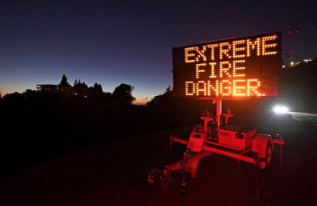 Sign reading 'Extreme Fire Danger' at night