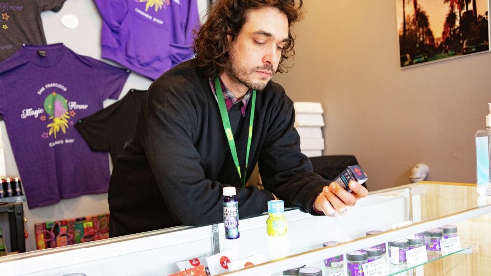 man behind counter of SF pot shop
