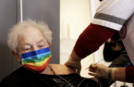 stock art shows older person receiving a vaccine shot