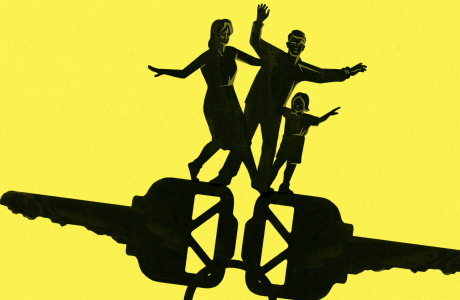 Silhouette of mother, father and child balance on a large set of keys