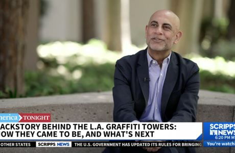 Man sitting outside as part of news footage