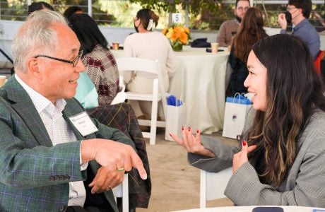 Michael Woo, former city councilman and university dean, with UCLA Luskin public policy student Zin Nyein. Photo by Amy Tierney
