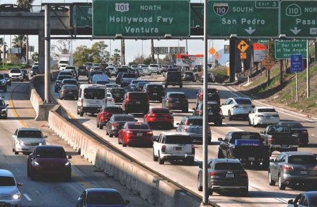 traffic congestion on freeways under freeway signs