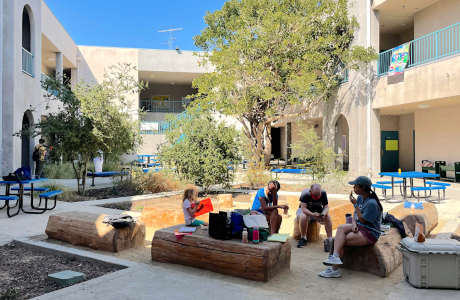 Group sitting in school playground