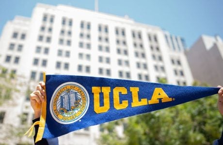 UCLA pennant in foreground, large white building in background