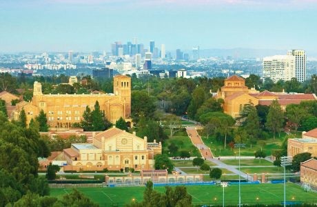 UCLA campus at twilight with Los Angeles skyline in the background