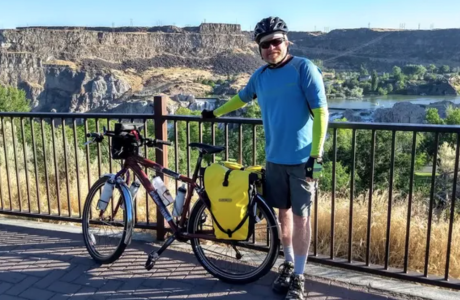 Man with bike outdoors