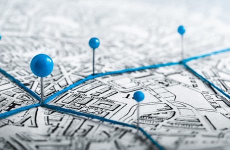 file art of pins on a map