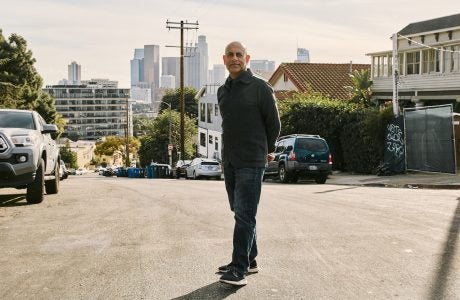 Man standing in residential neighborhood