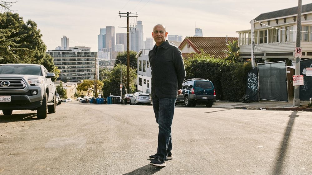Man standing in residential neighborhood