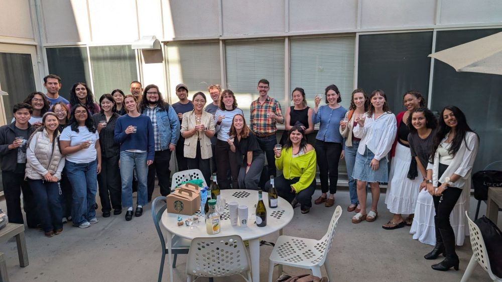 Back of a student in a graduation cap and gown.
