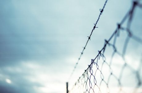 barbed wire above chainlink fence
