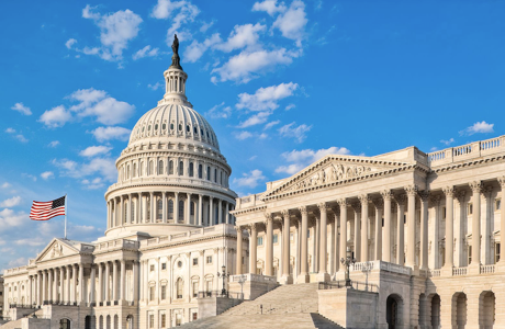 Photo of U.S. Capitol building set against blue sky