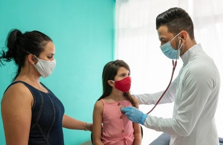 Doctor examining child