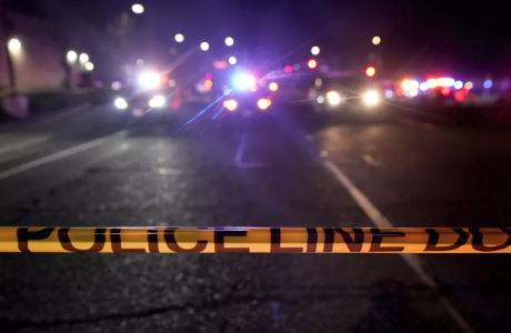 police tape in front of crime scene at night