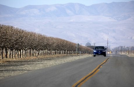 file photo of an electric vehicle on a highway