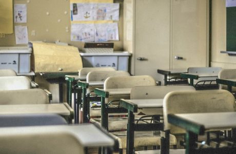 desks and chairs in empty classroom