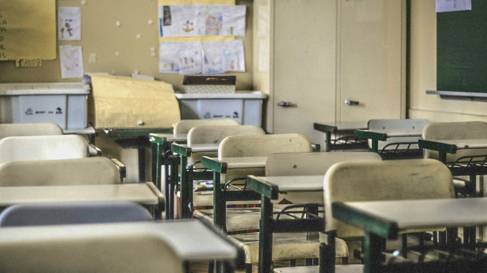 desks and chairs in empty classroom