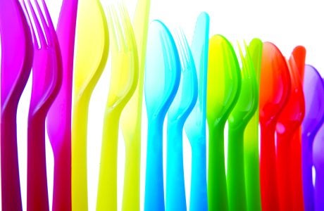 stock illustration of plastic utensils|stock illustration shows a policeman colored blue amid other faces of various colors|stock illustration shows commuters on a bus or train