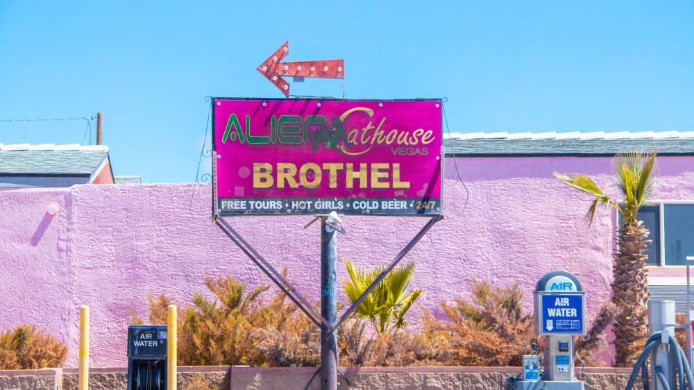 image of a road sign for an adult business