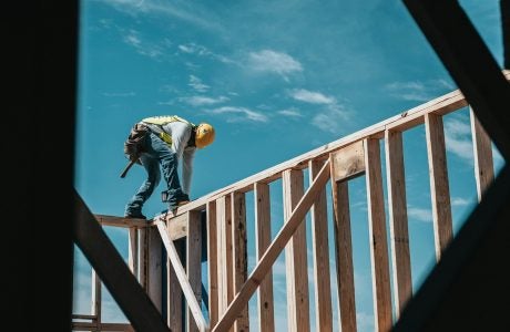 Construction worker on wood frame