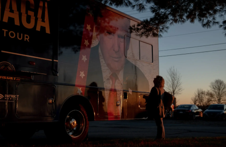 Woman in front of Trump campaign truck