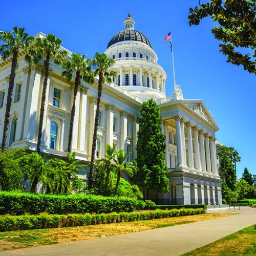 California State Capitol building on a sunny day in Sacramento. The California State Capitol stands as a historic edifice, combining neoclassical architecture with the functions of state government.