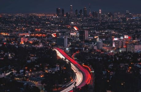 Aerial view of LA skyline and congested freeways at night