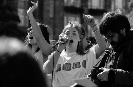 black and white photo of young woman protesting