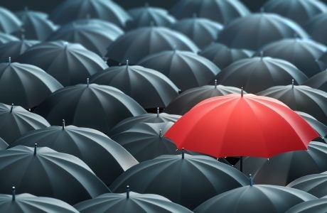Red Colored Umbrella Between The Black Umbrellas