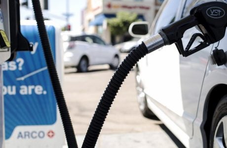 image of a vehicle at a gas station pumping gas