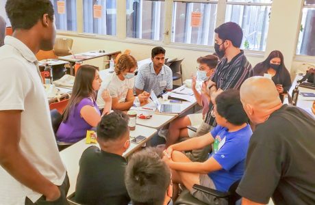 young people huddle in discussion